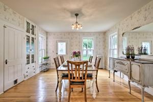 a dining room with a table and chairs at Historic Wabasha Home with Patio in Downtown! in Wabasha