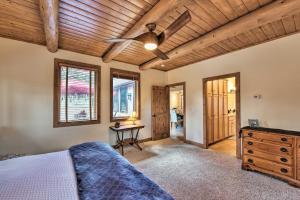 a bedroom with a bed and a ceiling fan at Pet-Friendly Buena Vista Home with Mtn Views! in Buena Vista