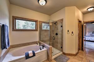 a bathroom with a tub and a shower at Pet-Friendly Buena Vista Home with Mtn Views! in Buena Vista +16 photos
