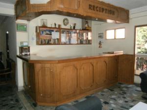 a bar in a room with wooden cabinets at Hotel Red Planet in Kathmandu