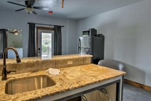 a kitchen with a sink and a counter top at Lava Hot Springs Studio 4-Min Walk to Pools! in Lava Hot Springs