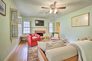 a living room with a couch and a ceiling fan at Lexington Getaway with Backyard Deck Less Than 2 Mi to UK! in Lexington