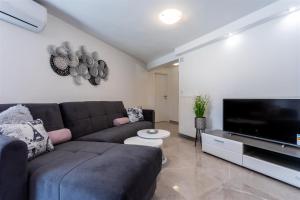 TV a/nebo společenská místnost v ubytování Apartment Roko