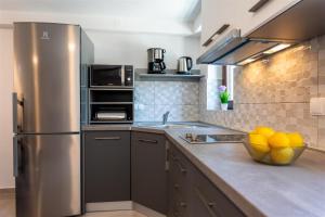 Kuchyň nebo kuchyňský kout v ubytování Apartment Roko