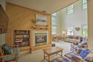 a living room with a fireplace and a couch at Spacious Mercersburg Home at Whitetail Resort in Clear Spring