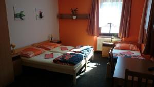Postel nebo postele na pokoji v ubytování Penzion a restaurace U Pošů