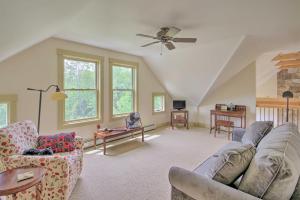 a living room with a couch and a table at Home with Fire Pit, 7 Mi to Attitash Mtn Resort in Jackson