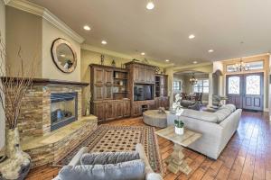 a living room with couches and a fireplace at Elk Grove Getaway with Saltwater Pool Near Wineries! in Elk Grove