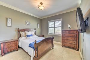 a bedroom with a bed and a flat screen tv at Near Wineries Elk Grove Getaway with Saltwater Pool in Elk Grove +31 photos