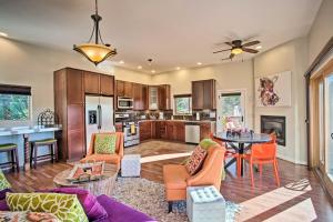 a kitchen and living room with a couch and a table at West Sedona House with Furnished Patio and Views! in Sedona