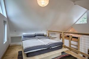 a bedroom with a large bed in a attic at Downtown St Augustine, The Lincolnville Loft in Saint Augustine