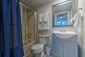 a bathroom with a toilet and a sink and a shower at Mount Ida Condo - Walk to Lake Ouachita! in Mount Ida +19 photos