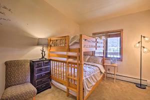 a bedroom with a bunk bed and a chair at Copper Mountain Resort Condo on Golf Course! in Copper Mountain +20 photos