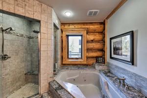 a large bathroom with a tub and a shower at 22STR-00019 Fairplay Cabin with Hot Tub and Sauna in Fairplay +26 photos