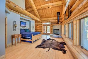 a bedroom with a bed and a fireplace at 22STR-00019 Fairplay Cabin with Hot Tub and Sauna in Fairplay