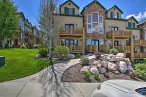 a large house with a landscaping in front of it at 2-Condo Property with Mtn Views by Golf and Ski Resort in Eden