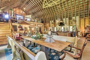 a large room with a wooden table and chairs at Historic Winston-Salem Guest Barn on Farm! in Winston-Salem +27 photos