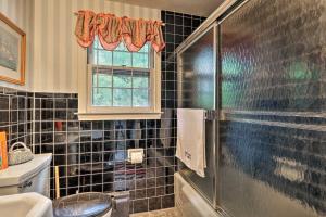 a bathroom with a shower and a toilet and a window at Saybrook Manor House, Walk to Cove Beach! in Old Saybrook +16 photos