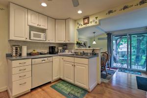 a kitchen with white cabinets and a counter top at Saybrook Manor House, Walk to Cove Beach! in Old Saybrook