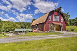 a red barn with a gambrel roof at Historic Winston-Salem Guest Barn on Farm! in Winston-Salem