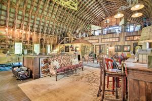a large room with couches and chairs in a building at Historic Winston-Salem Guest Barn on Farm! in Winston-Salem