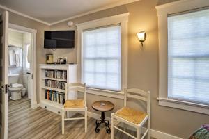 a room with two chairs and a table and a tv at Ocean-View Home - Walk to Avalon City Center! in Avalon