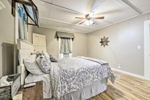 a bedroom with a bed and a ceiling fan at Day Trip to Waco and Temple House on Cattle Farm in Lorena