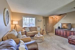 a living room with a couch and a tv at Destin Townhome with Beach Access & 2 Pools! in Destin