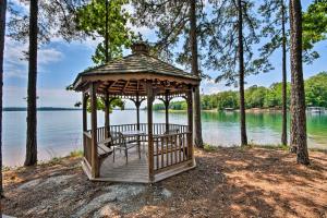 a gazebo on the shore of a lake at Lake Keowee Resort Condo with Balcony and Pool Access! in Salem