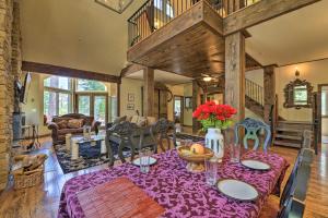 a dining room with a table with flowers on it at Incredible Lake Arrowhead Home with Views and Decks! in Lake Arrowhead