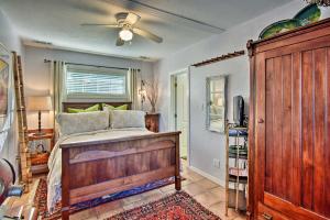 a bedroom with a bed and a ceiling fan at Altamonte Springs Home with Canoe on Lake Marion in Orlando