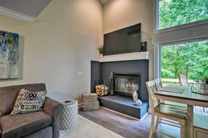 a living room with a fireplace and a table at Harbor Springs Condo about 6 Mi to Lake Michigan! in Harbor Springs