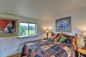 a bedroom with a bed and two windows at Columbia Falls Home 19 Mi to Glacier National Park in Columbia Falls