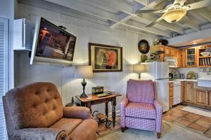 a living room with a couch and a chair and a table at Altamonte Springs Home with Canoe on Lake Marion in Orlando