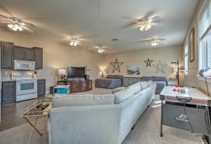 a living room with a couch and a tv at Studio Short Walk to Marina and DT St Augustine in Saint Augustine