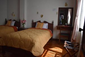 Postel nebo postele na pokoji v ubytování Hotel Huasi Continental