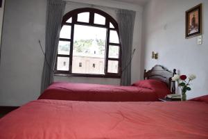 Postel nebo postele na pokoji v ubytování Hotel Huasi Continental