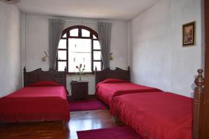 Postel nebo postele na pokoji v ubytování Hotel Huasi Continental