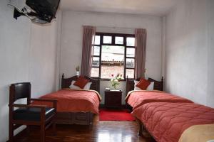 Postel nebo postele na pokoji v ubytování Hotel Huasi Continental + 37 fotografií