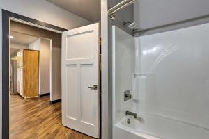 a bathroom with a shower and a white door at Black Hills Retreat about 3 Mi to ATV Trails! in Piedmont +20 photos