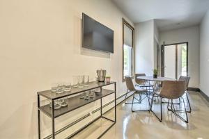 a dining room with a table with wine glasses on it at Elkhart Lake Townhome - 20 Mi to Sheboygan! in Elkhart Lake