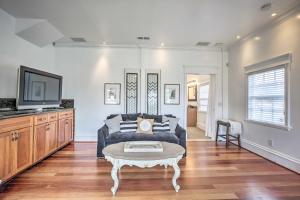 a living room with a couch and a tv at San Diego Home with Yard - 2 Blocks to the Bay! in San Diego