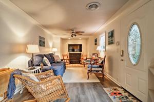 a living room with a blue couch and chairs at Ottawa Lake Home with BBQ and Patio, 15 Mi to Toledo in Sylvania