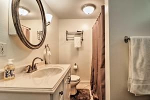 a bathroom with a sink and a mirror at Ottawa Lake Home with BBQ and Patio, 15 Mi to Toledo in Sylvania +18 photos