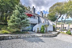 a large white house with a large driveway at All-Season Base! Unit w/ Balcony in Beech Mountain in Beech Mountain