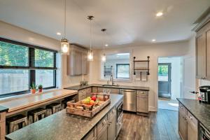 a kitchen with a island with a bowl of fruit on it at Updated Downtown Red Bank Home 5 Mi to Beach! in Red Bank