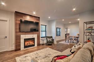 a living room with a couch and a fireplace at Updated Downtown Red Bank Home 5 Mi to Beach! in Red Bank