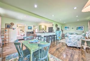 a kitchen and living room with a table and chairs at Half-Mi to Seadrift Harbor Seadrift Home with Deck in Seadrift