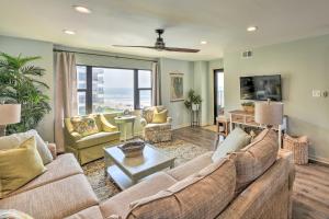 a living room with a couch and a table at Atlantic Beach Resort Condo with Ocean Views! in Atlantic Beach