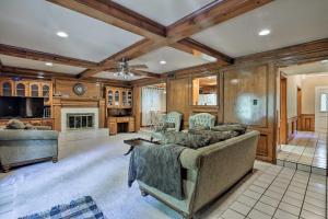 a living room with a couch and a fireplace at Dallas Area Home with Pool - 18 Mi to ATandT Stadium! in Duncanville